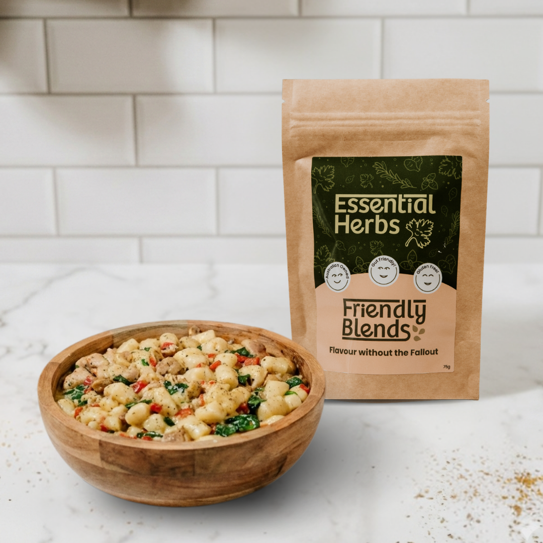 Wooden bowl of Gnocchi with 'Essential Herbs Friendly Blends' packaging on a white tiled background