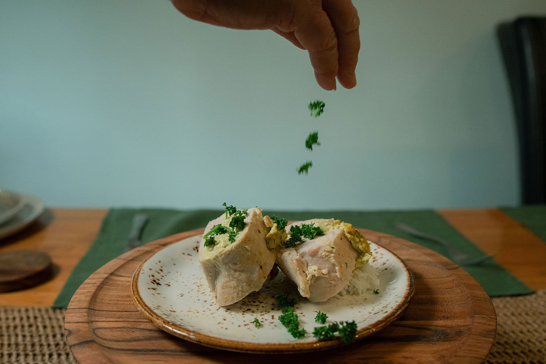 Golden baked chicken breasts stuffed with spinach and artichoke, seasoned with a low FODMAP chicken seasoning.