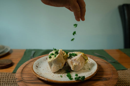 Golden baked chicken breasts stuffed with spinach and artichoke, seasoned with a low FODMAP chicken seasoning.