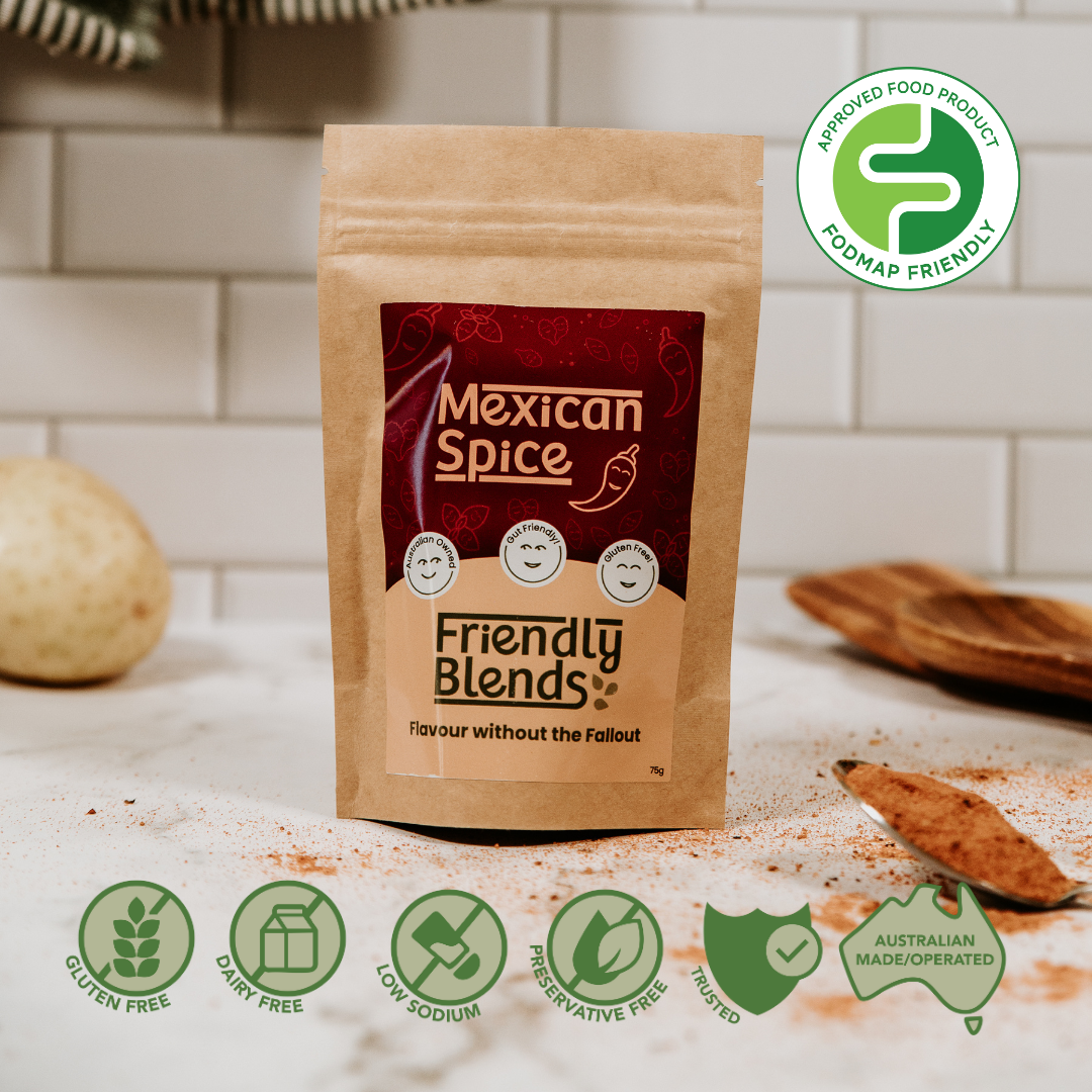 Package of 'Friendly Blends Mexican Spice' on a kitchen counter with Low FODMAP certification icons.